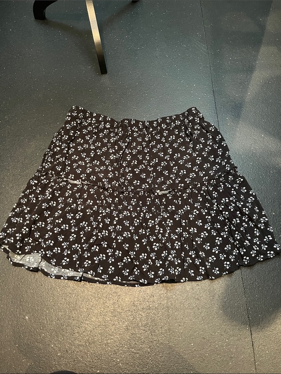 Ricki's Dresses & Skirts - Ricki's Black Mini Skirt with White Floral Print